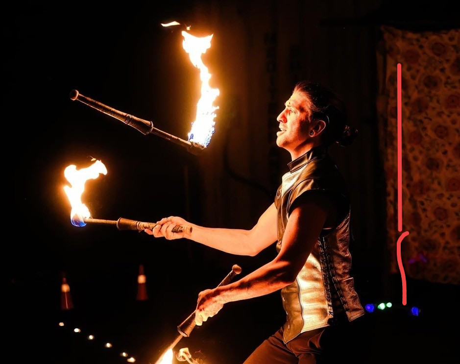 Ignite Entertainment fire performer juggling flaming torches at a luxury event